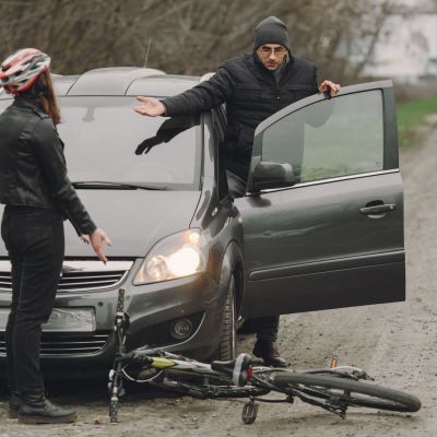Road accident with cyclist man driver and car
