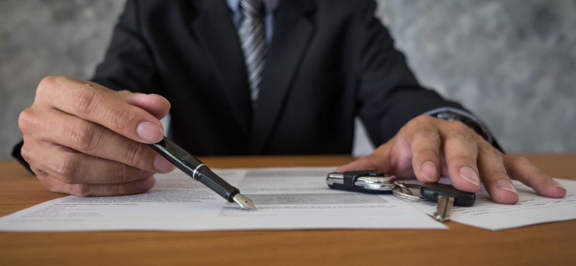 transportation and ownership concept - customer and salesman wit