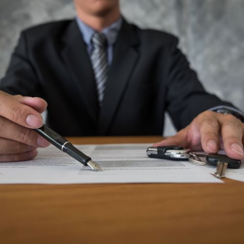 transportation and ownership concept - customer and salesman wit